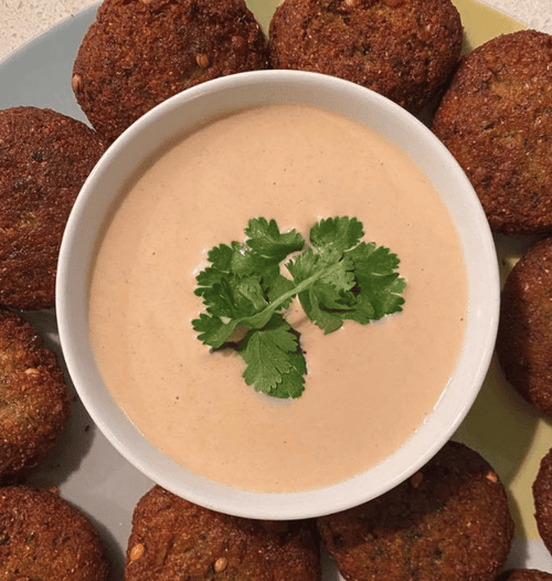 Smooth & creamy tahini dip in small bowl